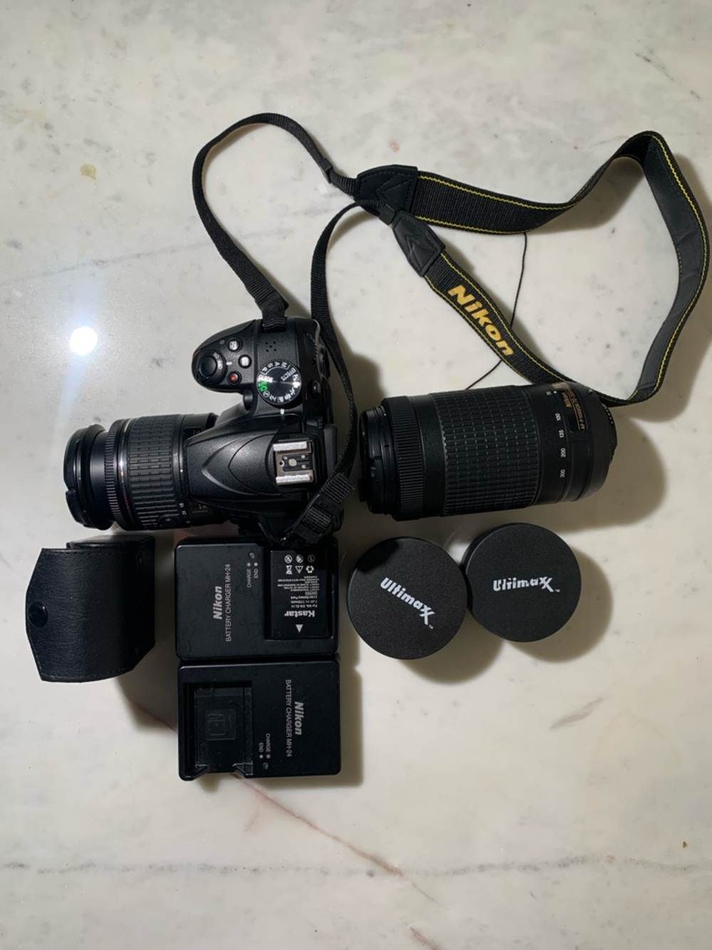 Nikon Black DSLR Camera with Two Zoom Lenses and Accessories